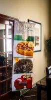 a sign on a wall with pictures of food at Quality Inn Airport in Colorado Springs