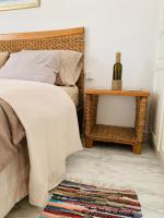 Au coeur du village sidi bousaidにあるベッド