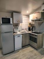 Kuchnia lub aneks kuchenny w obiekcie Mobil-home Les Locs Danous