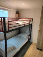 Łóżko lub łóżka w pokoju w obiekcie Mobil-home Les Locs Danous