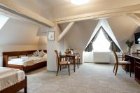 Łóżko lub łóżka w pokoju w obiekcie Hotel Kardosfa