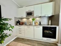 Kuchyň nebo kuchyňský kout v ubytování Ferienwohnung Nr 124 Sehnsucht-Zingst