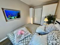 Postel nebo postele na pokoji v ubytování Ferienwohnung Nr 124 Sehnsucht-Zingst