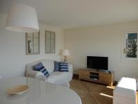 Televízia a/alebo spoločenská miestnosť v ubytovaní Apartamento Consolat de Mar Cambrils