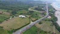 an aerial view of a highway next to the ocean at The Blue Lagoon B&amp;B in Fengbin