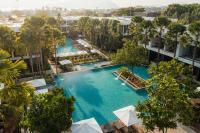 an overhead view of a large pool with trees and buildings at Stay Wellbeing & Lifestyle Resort in Rawai Beach