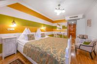 Łóżko lub łóżka w pokoju w obiekcie Boutique Hotel Szárcsa