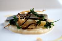 a piece of food on a white plate at Alpengasthaus Gießlhütte in Wolfsberg