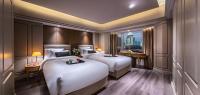Elegant International Hotel Shanghai - Bund Sichuan Road North Metro Branchにあるベッド