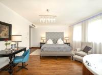 Łóżko lub łóżka w pokoju w obiekcie Boutique Hotel Szárcsa