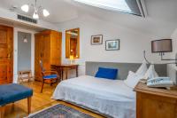 Łóżko lub łóżka w pokoju w obiekcie Boutique Hotel Szárcsa