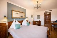Łóżko lub łóżka w pokoju w obiekcie Boutique Hotel Szárcsa