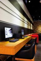 a desk with a computer on top of it at Airline Inn Green Park Way in Taichung