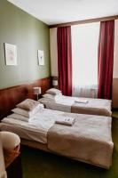 Łóżko lub łóżka w pokoju w obiekcie Hotel Yarden by Artery Hotels