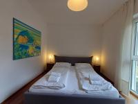 Łóżko lub łóżka w pokoju w obiekcie Falcon Lodge Kaprun Kitzsteinhorn - Steinbock Lodges