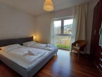 Łóżko lub łóżka w pokoju w obiekcie Falcon Lodge Kaprun Kitzsteinhorn - Steinbock Lodges