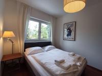 Łóżko lub łóżka w pokoju w obiekcie Falcon Lodge Kaprun Kitzsteinhorn - Steinbock Lodges