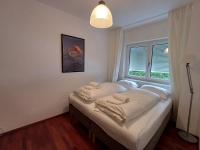 Łóżko lub łóżka w pokoju w obiekcie Falcon Lodge Kaprun Kitzsteinhorn - Steinbock Lodges