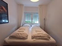 Łóżko lub łóżka w pokoju w obiekcie Falcon Lodge Kaprun Kitzsteinhorn - Steinbock Lodges