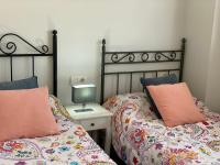 A bed or beds in a room at Los tres castells