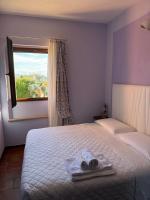 Posteľ alebo postele v izbe v ubytovaní Agriturismo Maloura