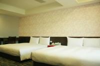 &#x141;&oacute;&#x17C;ko lub &#x142;&oacute;&#x17C;ka w pokoju w obiekcie LIHO Hotel Tainan