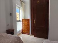 A bed or beds in a room at Torremolinos Beach Apartment