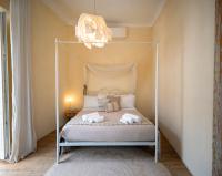 A bed or beds in a room at Ai due Mori Apt by Addler House Ospitality