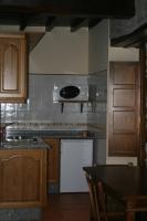 Kuchyň nebo kuchyňský kout v ubytování Apartamentos Rurales El Palacio de Doiras