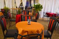 ein Raum mit Tischen und Stühlen, auf denen jeweils eine Nummer steht in der Unterkunft Gateway Bliss Gardens in Nairobi