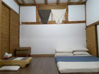 Ein Bett oder Betten in einem Zimmer der Unterkunft Yettle Hanok Stay