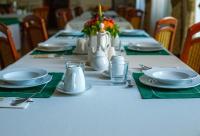 a long table with plates and napkins on it at Dom rekolekcyjny Vincentinum in Krzeszowice