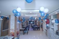 a room with blue and white balloons on the ceiling at Hotel Asian Comfort in Srinagar