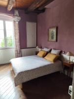 Łóżko lub łóżka w pokoju w obiekcie La Villa Romaine