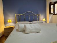 Posteľ alebo postele v izbe v ubytovaní Casa Gioeni