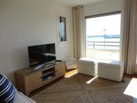 Televízia a/alebo spoločenská miestnosť v ubytovaní Apartamento Consolat de Mar Cambrils