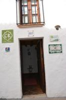 a door to a building with a sign above it at La Carrihuela in Algodonales