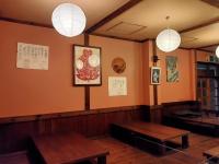 a dining room with two tables and lights on the wall at Matsunoki-tei in Otari