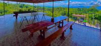 a balcony with a bench and a piano on it at Hotel Campestre Quimbaya Cafetero in Quimbaya