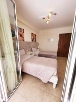 A bed or beds in a room at B&B Waltanna Airport