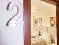 A bed or beds in a room at B&B Waltanna Airport