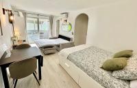 A bed or beds in a room at FUENGIROLA Los Boliches MALAGA - GREEN LOVE
