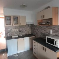 Kuchyň nebo kuchyňský kout v ubytování Apartments Max