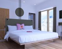 Łóżko lub łóżka w pokoju w obiekcie Hotel Blü Gastein