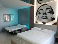 Posteľ alebo postele v izbe v ubytovaní Hotel Camelia