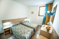 Łóżko lub łóżka w pokoju w obiekcie Hotel Johnson