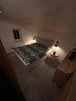 Postel nebo postele na pokoji v ubytování Apartmán Lesní zátiší Marlenka