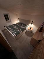 Postel nebo postele na pokoji v ubytování Apartmán Lesní zátiší Marlenka