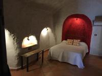 Postel nebo postele na pokoji v ubytování Casas Cueva y Cortijo La Tala en Guadix