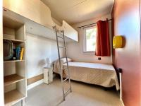 Posteľ alebo postele v izbe v ubytovaní Camping Village Tuscia Tirrenica